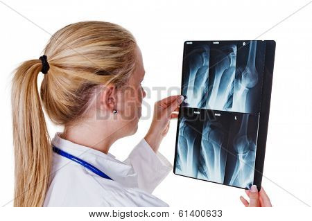 a young doctor with stethoscope in her doctor's office.