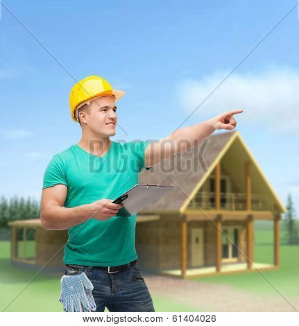 repair, construction and maintenance concept - smiling man in helmet with clipboard pointing finger