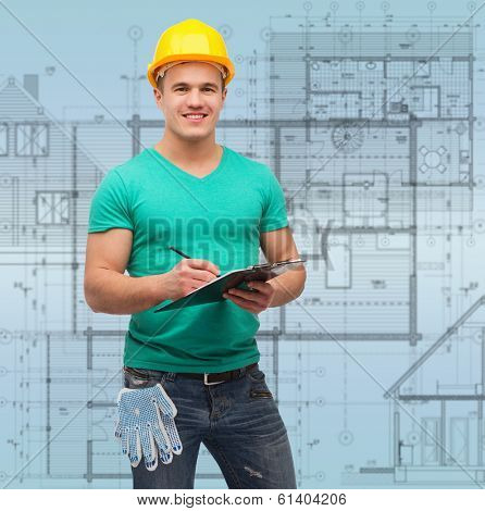 repair, construction and maintenance concept - smiling man in helmet with clipboard