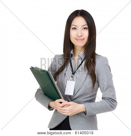 Asian businesswoman with file pad and laptop