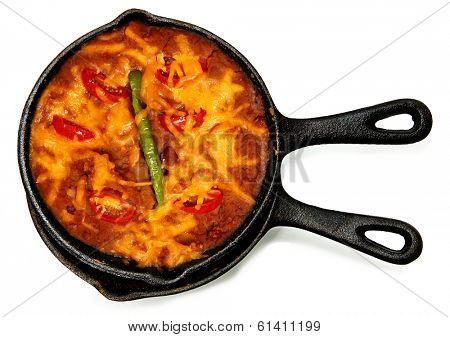 Skillet Refried Beans with Hot Peppers, Cherry Tomatos and Cheddar Cheese over white.