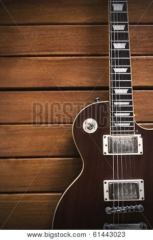Vintage Top Guitar On Old Wood Surface.