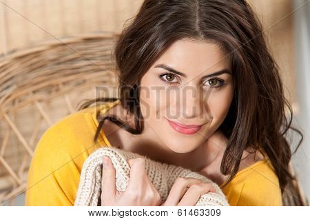 Close up of woman smiling and feeling cozy