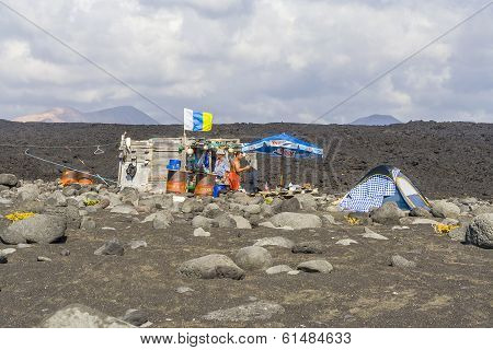 People At A Fishermans Hut  At Volcanic Beach In Timanfaya