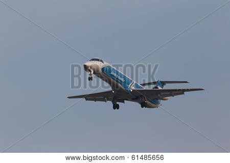 Dniproavia Airlines Embraer ERJ-145LR aircraft on the blue sky background
