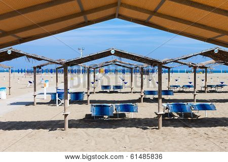 Rows Of The Palm Leaf Sun Shades On The Beach