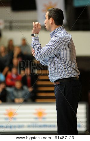 KAPOSVAR, HUNGARY - MARCH 8: Adam Fekete (Kaposvar trainer) in action at a Hungarian Championship basketball game with Kaposvar (white) vs. Paks (red) on March 8, 2014 in Kaposvar, Hungary.