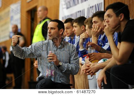 KAPOSVAR, HUNGARY - MARCH 8: Adam Fekete (Kaposvar trainer) in action at a Hungarian Championship basketball game with Kaposvar (white) vs. Paks (red) on March 8, 2014 in Kaposvar, Hungary.