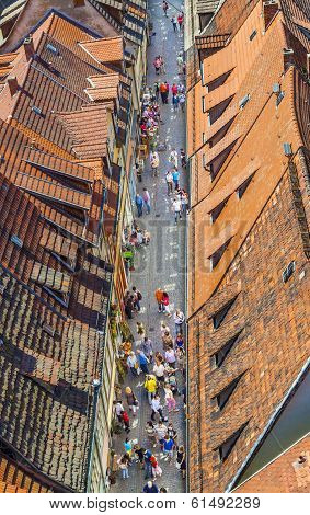 People Visit The Ancient Street At Kramerbruecke In Erfurt
