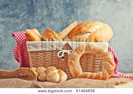 Delicious Bread And Rolls In Wicker Basket
