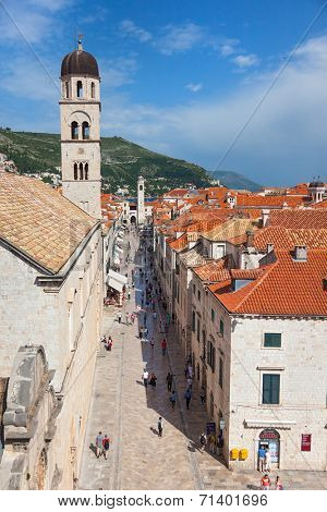 DUBROVNIK, CROATIA - MAY 26, 2014: View on Stradun and the Franciscan Monastery from old city walls. Stradun is 300 meters long main pedestrian street in Dubrovnik.