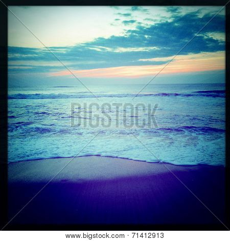 Instagram filtered image of the sunrise and surf on the Outer Banks shorline