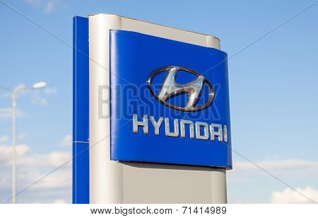 Samara, Russia - August 30, 2014: Hyundai Dealership Sign Against Blue Sky. Hyundai Motor Company Is