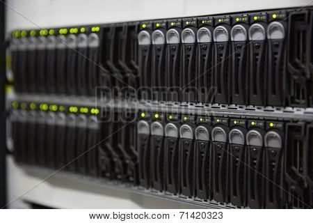 Black rack mounted server tower in large data center