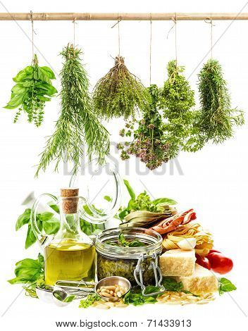 Pesto Sauce And Italian Food Ingredients On White