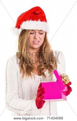Festive blonde opening a gift on white background