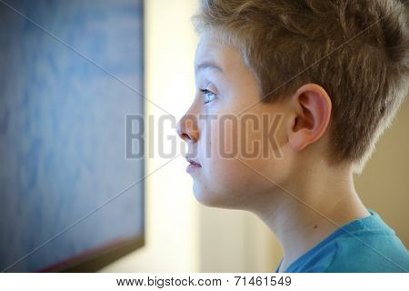 Boy watching television with noise