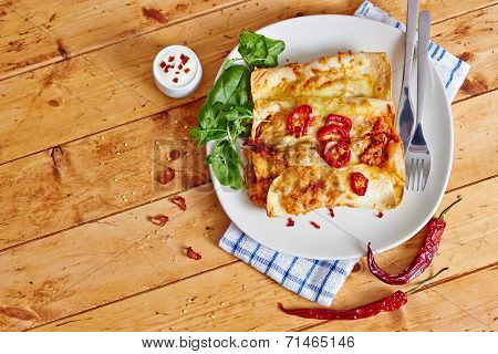 Enchiladas with cream and red peppers