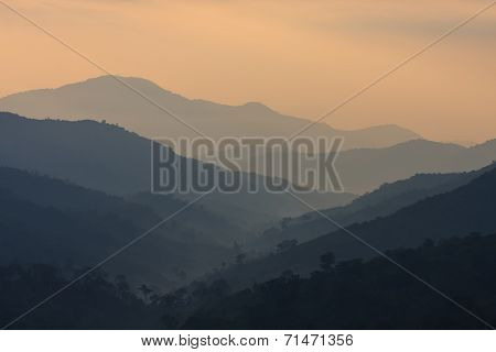 The Layers Of Mountains At The Dawn Time