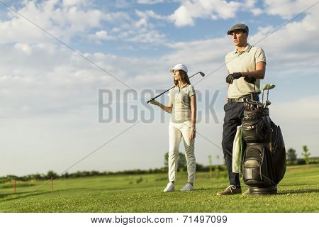 Young Couple At Golf Cart