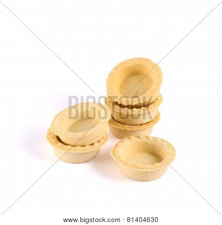 Pile of empty tartlets isolated
