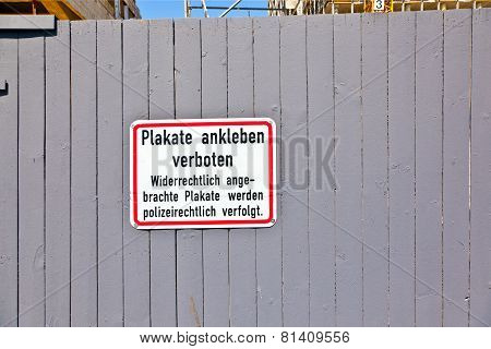 Grey Wooden wall with sign no posters