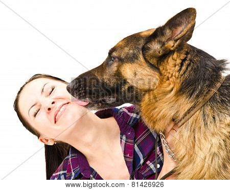Portrait of a smiling young woman who licks German Shepherd