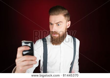 Young man with beard making selfie