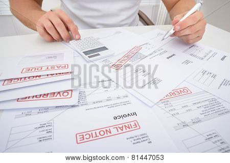 Man Calculating Unpaid Bills