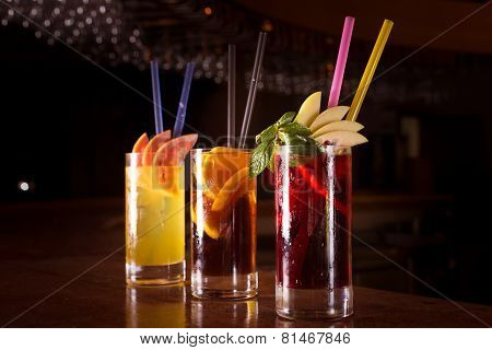 Cherry Bomb, Screwdriver And Cuba Libre Cocktails In A Tall Glasses