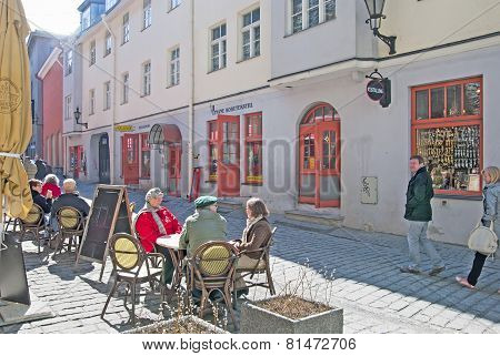 Tallinn. Estonia. Mature people in open air cafe. Old Town