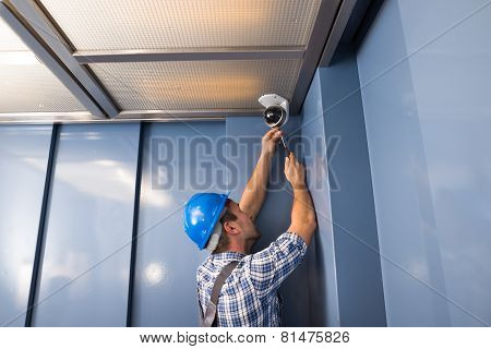 Cctv Technician Fixing Camera