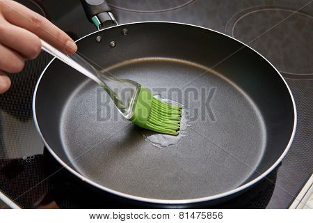 Brush With Sunflower Oil In Frying Pan