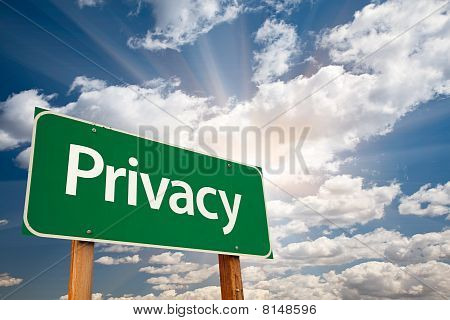 Privacy Green Road Sign Over Clouds