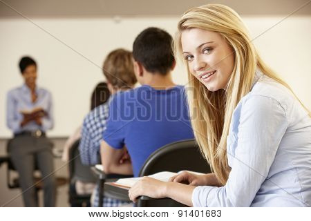 Teenage girl in class smling to camera