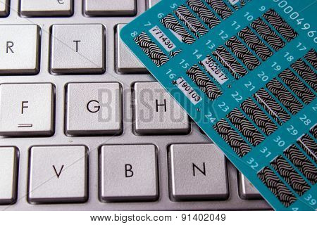 Card On A Computer Keyboard