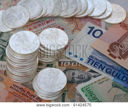 International currency and walking libery silver