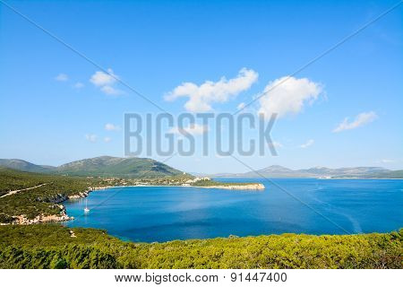 Capo Caccia Shoreline Under A Blue Sky
