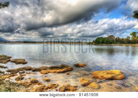 Reflection In Lake Calik In Sardinia In Hdr
