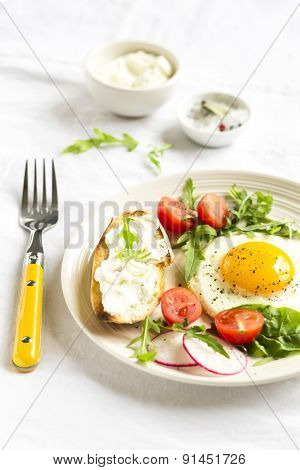 Fried Eggs with cherry tomatoes, arugula and radishes And Toast With Cheese
