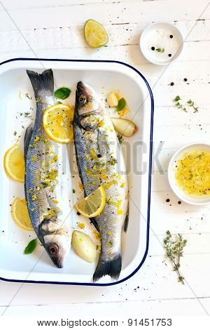 Sea Bass With Lemon And Thyme On A Light Background
