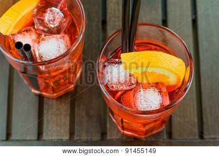Top Of View Of Glasses Of Spritz Aperitif Aperol Red Cocktail With Orange Slices And Ice Cubes