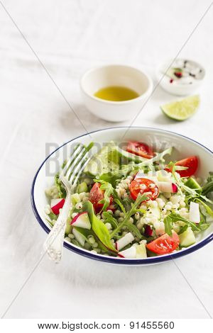 Vegetable Salad With Pasta In A Vintage Plate On A Light Surface
