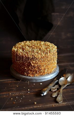 Honey Cake On A Dark Wooden Surface In Vintage Style