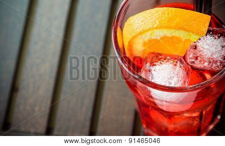 Top Of View Of Spritz Aperitif Aperol Cocktail Glass With Orange Slices And Ice Cubes