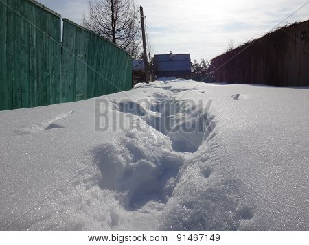 Winter village in sunny day