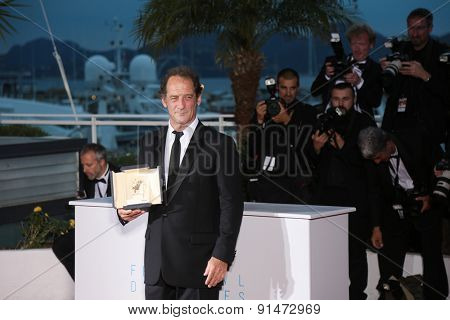 Actor Vincent Lindon, winner of the Best Actor Prize,  the film ' La Loi du Marche' . photocall for the winners of the Palm D'Or . 68th annual Cannes Film Festival on May 24, 2015 in Cannes, FranceÃ¢?Â¦