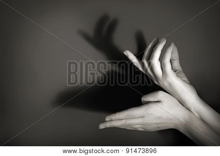 Hands gesture like deer on gray background