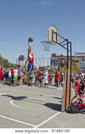 A Young Basketball Player Performs A Throw To The Slam Dunk Contest