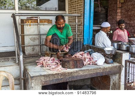 Indian Butcher Prepares Chicken